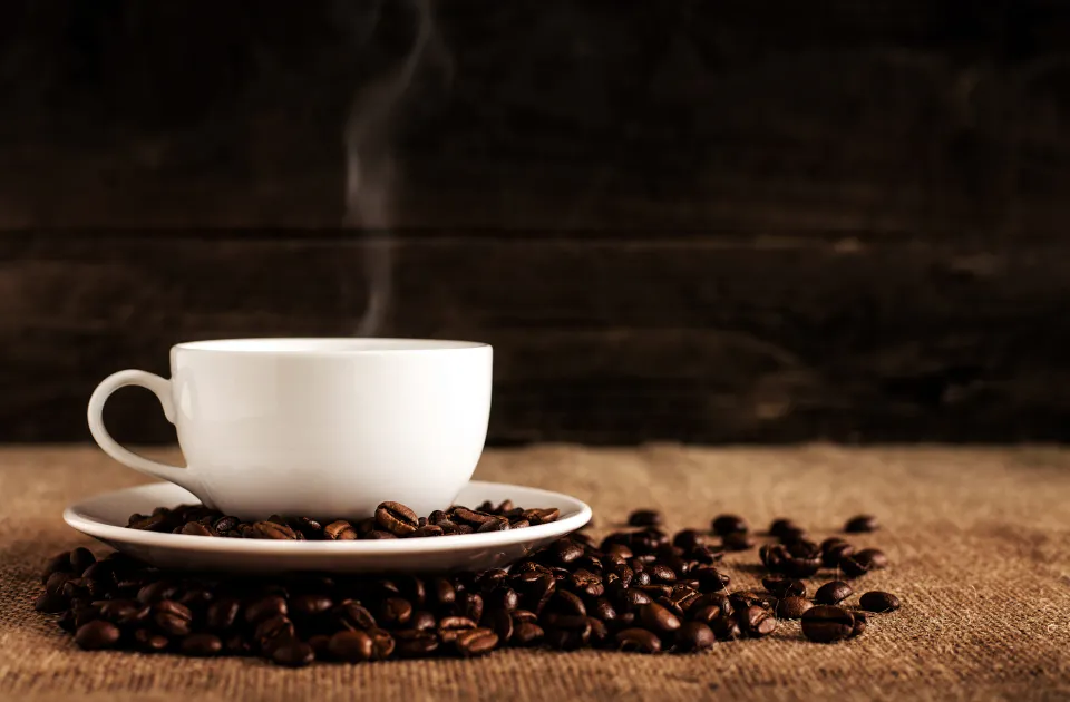 A warm cup of coffee on a wooden table